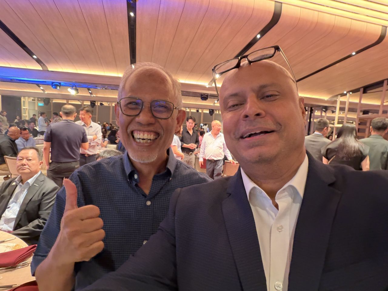 Rico Smith with a smiling guest at a dinner