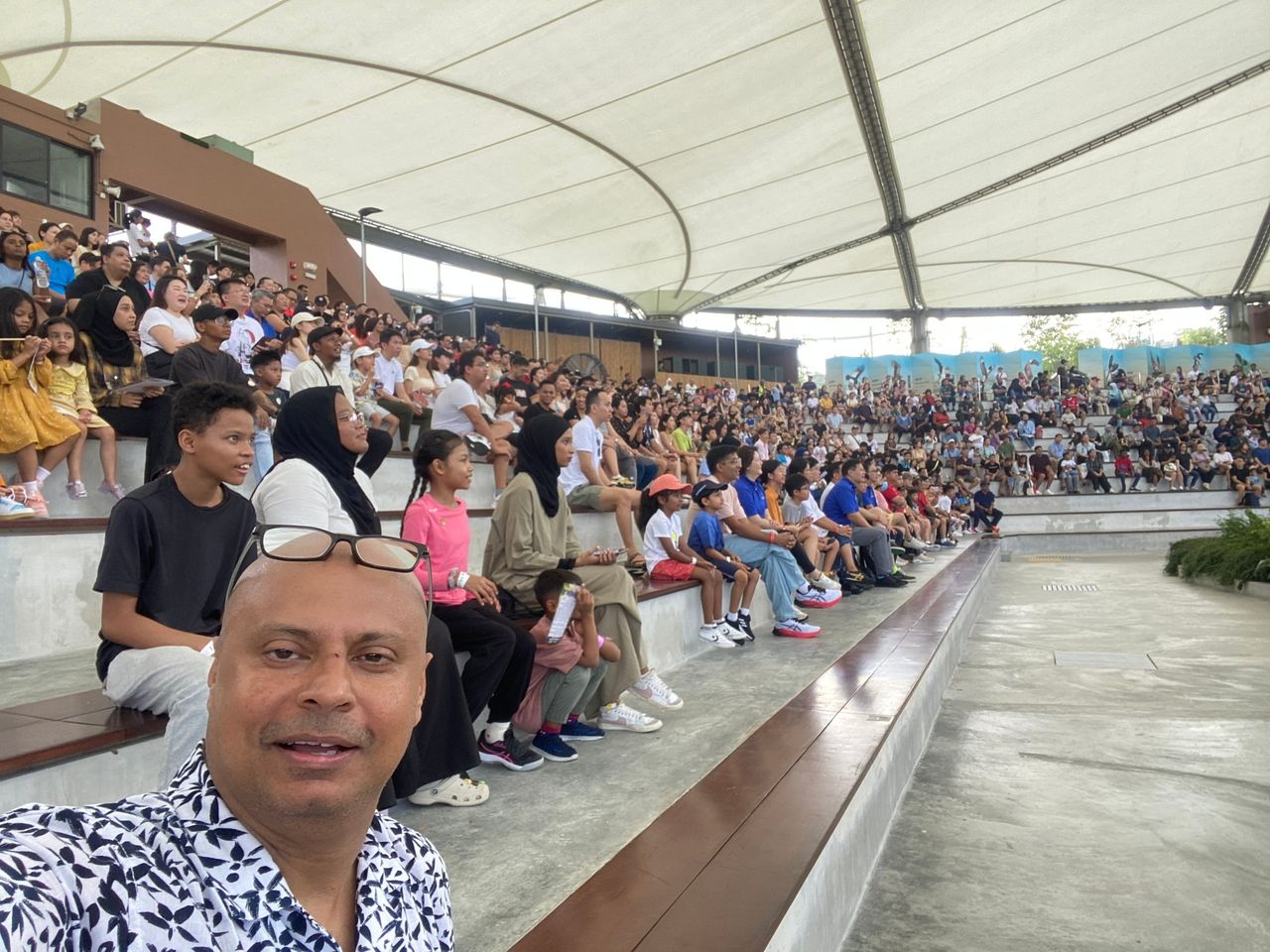 Rico Smith with a packed amphitheatre crowd behind him