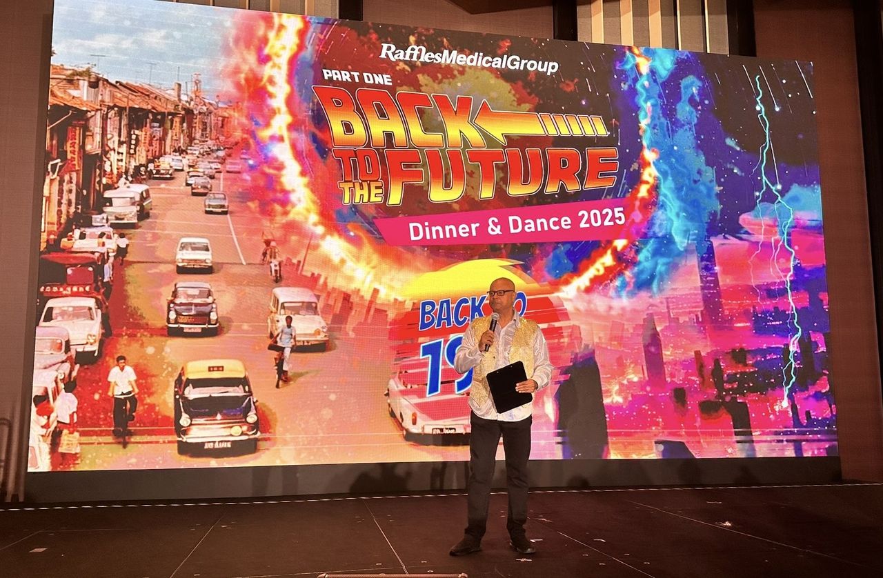 Rico Smith hosting the Raffles Medical Group Back to the Future dinner and dance