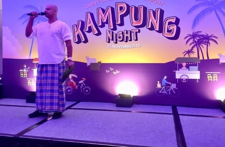 Rico Smith in a sarong hosting a Kampung Night
