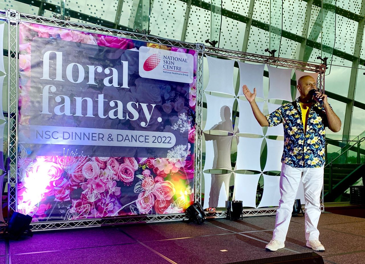 Rico Smith hosting the National Skin Centre Floral Fantasy dinner and dance